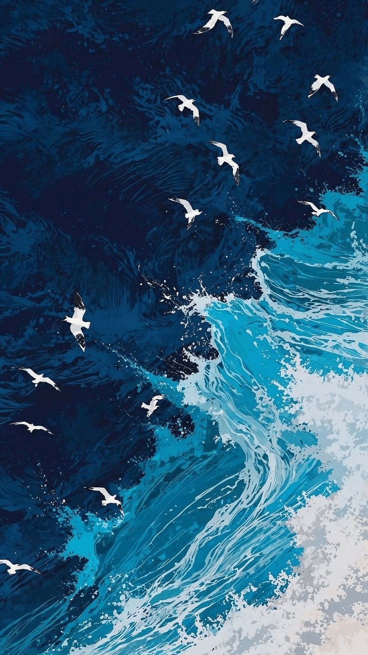 White seabirds flying over deep blue ocean waves